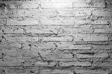 White brick wall with dim light shadow shade for building texture wallpaper background.