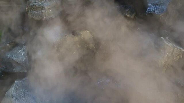 Abstract white smoke in slow motion. Smoke, Cloud of cold fog in light spot background. Light, white, fog, cloud, black background,ice smoke cloud. Floating fog.