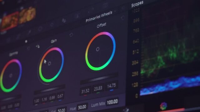 Color correction, color circles in the editing program on the computer display. A professional performs color correction of the video .