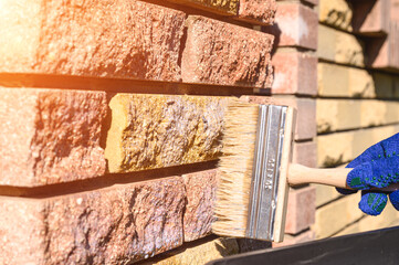 . A natural stone covered with a protective liquid from moisture and mold. Protect the stone from moisture. Drops of water on a rock. Hydrophobicity.