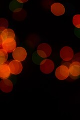 The multicolored side's or boke on a black background. Merry Christmas and happy New Year. Christmas background.
