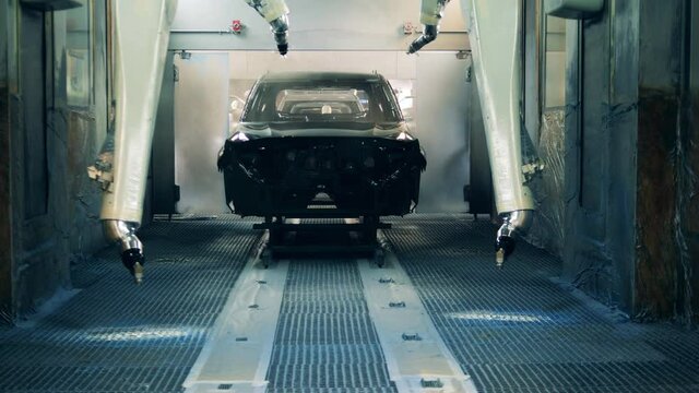 Robotic devices are galvanizing an automobile carcass