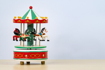 colorful carousel toy in white background. Horizontal