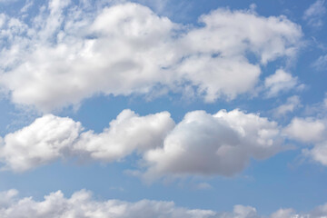 Naklejka na ściany i meble Background of blue sky with white clouds. Skyscape. Graphic design