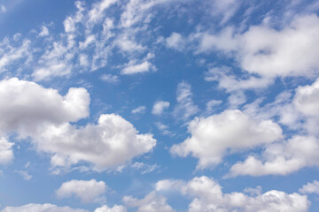 Naklejka na ściany i meble Background of blue sky with white clouds. Skyscape. Graphic design