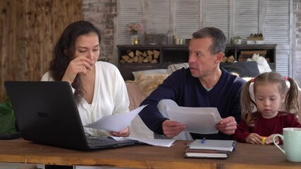 The family financial crisis, unemployment, joblessness, business problems during Covid-19. Worried mother father and child at home. Coronavirus, Quarantine, Social Distancing, Self-Isolation, Lockdown