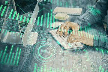 Technology theme hologram with man working on computer on background. High tech concept. Double exposure.