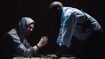 Violence by police officer against suspect in interrogation room