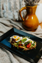 Healthy vegetarian food for a balanced diet rich in vitamins. Organic and regional products. Bread, tomatoes, avocado