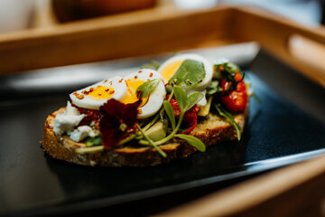 Healthy vegetarian food for a balanced diet rich in vitamins. Organic and regional products. Bread, tomatoes, avocado