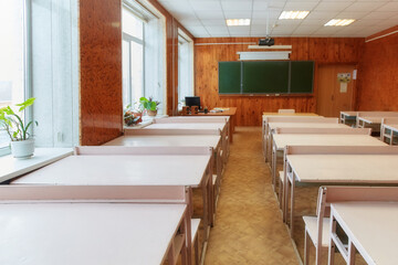 Interior of an empty school classroom. Concept of coronavirus COVID-19 quarantine in schools and educational institutions