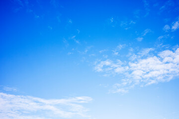 Fototapeta premium Blue sky background and white clouds soft focus, and copy space 