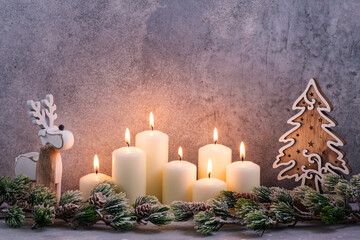 New Year card design with burning candles and tree