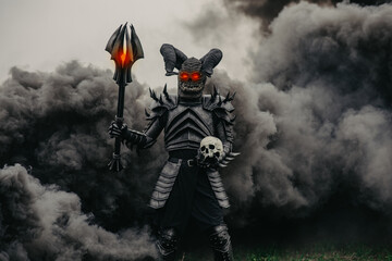 Mutant warrior stands with glowing eyes against a background of black smoke. © Stanislav