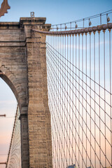 Sunset colors of Brooklyn Bridge with giant tower