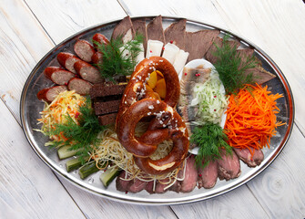 Set of various snacks for beer. Sausages, croutons, jerky, cabbage, herring.