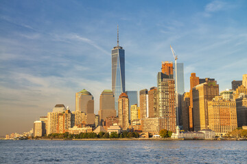 Naklejka na ściany i meble Amazing sunset colors of New York. Lower Manhattan skyline