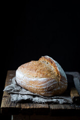 Fresh homemade crisp bread on wooden background. French bread. Bread at leaven. Unleavened bread