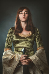 Queen with sword and eyes closed