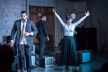 Theater actor artists on stage perform play for audience. Public performance. Theatre scene