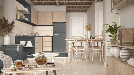 Cosy wooden sustainable kitchen and living room in gray tones with modern sofa and coffee tables. Tea time, glass teapot and teacup, snacks. Environmental friendly interior design