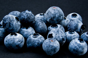 Blueberries against a black background
