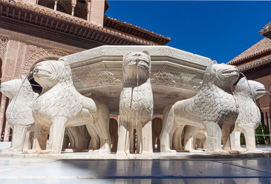 Splendid Lion fountain in Court of Lions (Nasrid Palace, Alhambra), surrounded by complex arcade with muqarnas arches and sebka decors,
