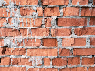 Obraz premium Ruined old red brick wall. Textured background.