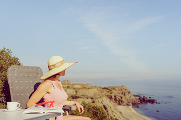 Woman on sea read book, relaxing