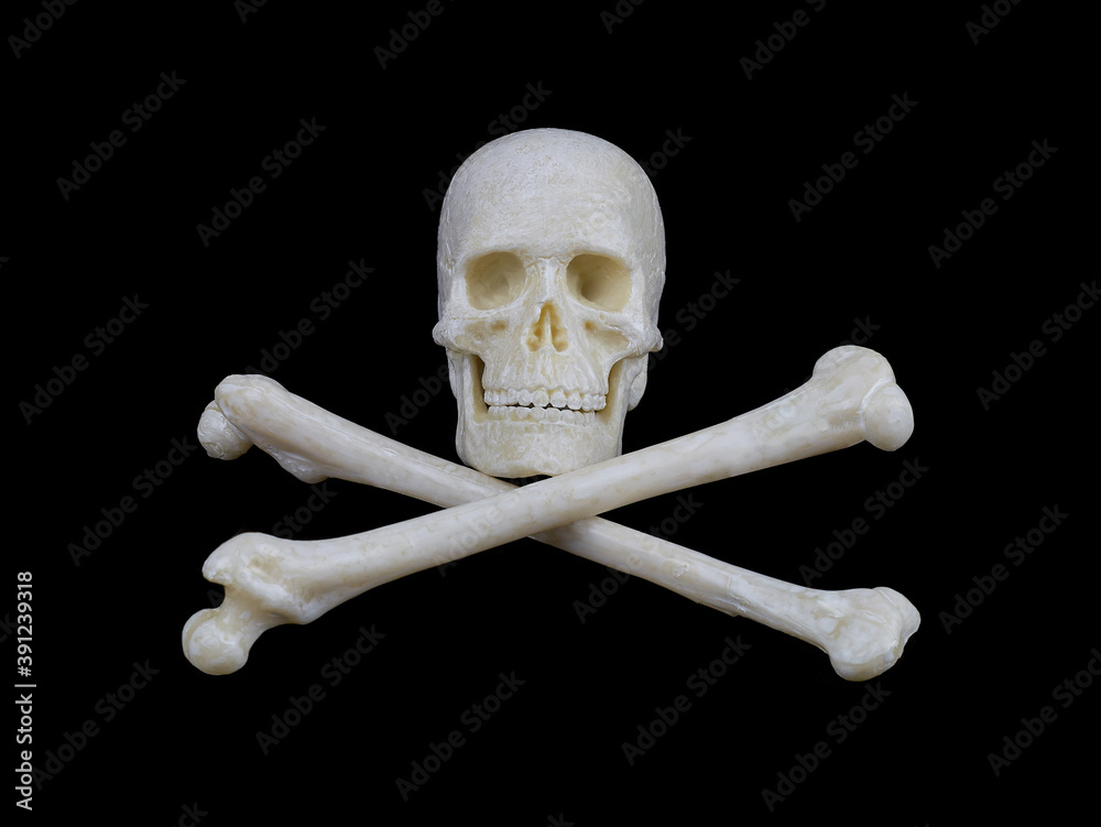 Wall mural human skull and crossed bones on a black background, a sign stop, be careful, dangerous.