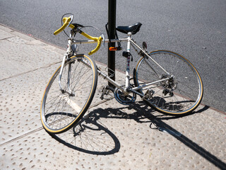 Naklejka na ściany i meble Abandoned bicycle in the street, bike damaged, street life, artistic object, attached alone