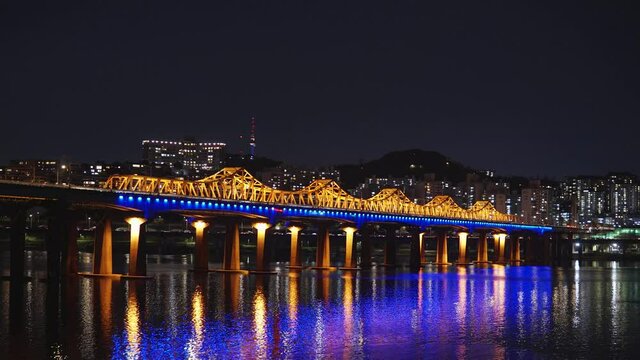 Illuminated Dongho Bridge night With High-rise Buildings In Background Spanning over Han River At Night In Seoul, South Korea. - wide static shot

Dongho, dongho bridge,