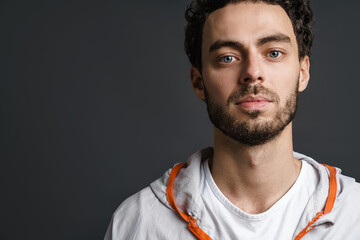 Unshaven handsome guy posing and looking at camera