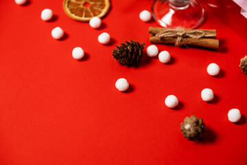 Fototapeta na wymiar white balls of cinnamon lemon cones on a red background