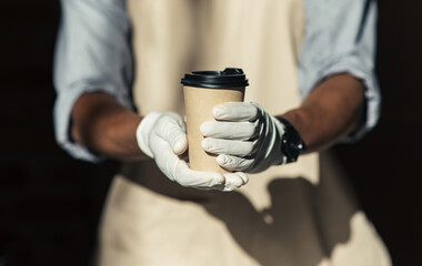 Takeaway coffee in eco paper cup and social distancing