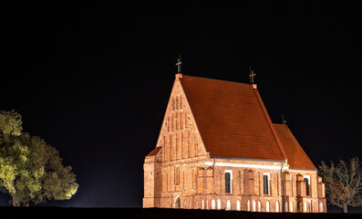 Zapyskis, Lithuania November 04 2020: early Gothic red brick church (built between 1530 and 1578)  In Lithuania, Zapyskis at night.