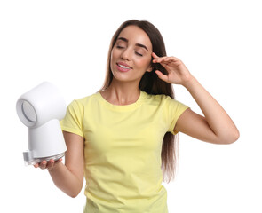 Naklejka premium Woman enjoying air flow from portable fan on white background. Summer heat