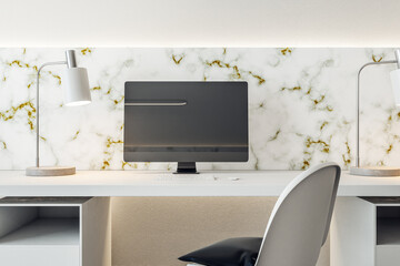 Interior of stylish office with computer on table with blank black screen.