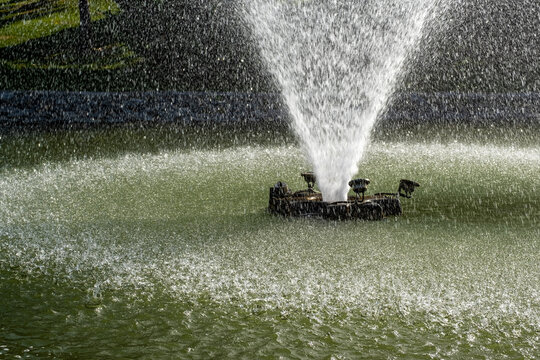 Water Fountain With Slashing Water In A Pond