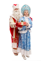 Russian Ded Moroz and Snegurochka in beautiful costumes with a gift. Celebrating New Year and Christmas. Full height. Isolated on white background. Vertical.