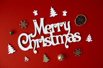 Naklejka na ściany i meble Merry Christmas greeting card. Red colour background with lettering.