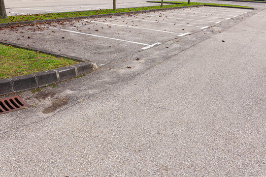 Empty Parking Lot With White Lines Marking Parking Spots 