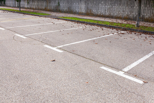 Empty Parking Lot With White Lines Marking Parking Spots 