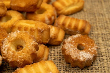Homemade shortbread cookies on coarse burlap. Close up. Tea party.