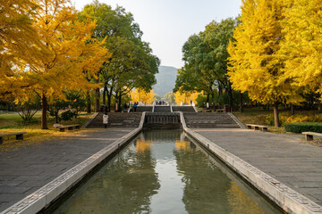 Fototapeta na wymiar In autumn, ancient building lofts and ginkgo trees are in Jinci Park, Taiyuan, Shanxi, China