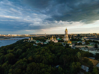 Aerial evening view to the Kyiv Pechersk Lavra monastery. Stormy golden hour