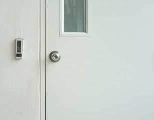 Close-up a security door for access with bar code of the building.