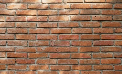 A texture and backgrounds a holizontal vintage red brick wall.