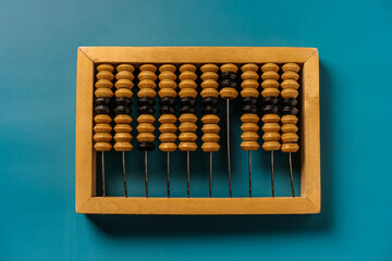 Top view of vintage abacus on a green background, the concept of mathematical calculations