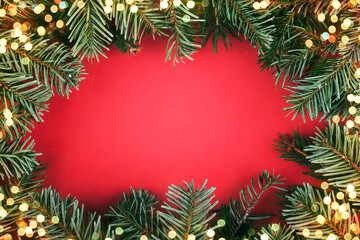 Fototapeta na wymiar Merry Christmas.Christmas concept background.Christmas tree branches and christmas lights